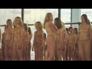 more than a hundred women in a naked performance