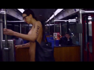 art performance - the artist rides naked in a crowded bus